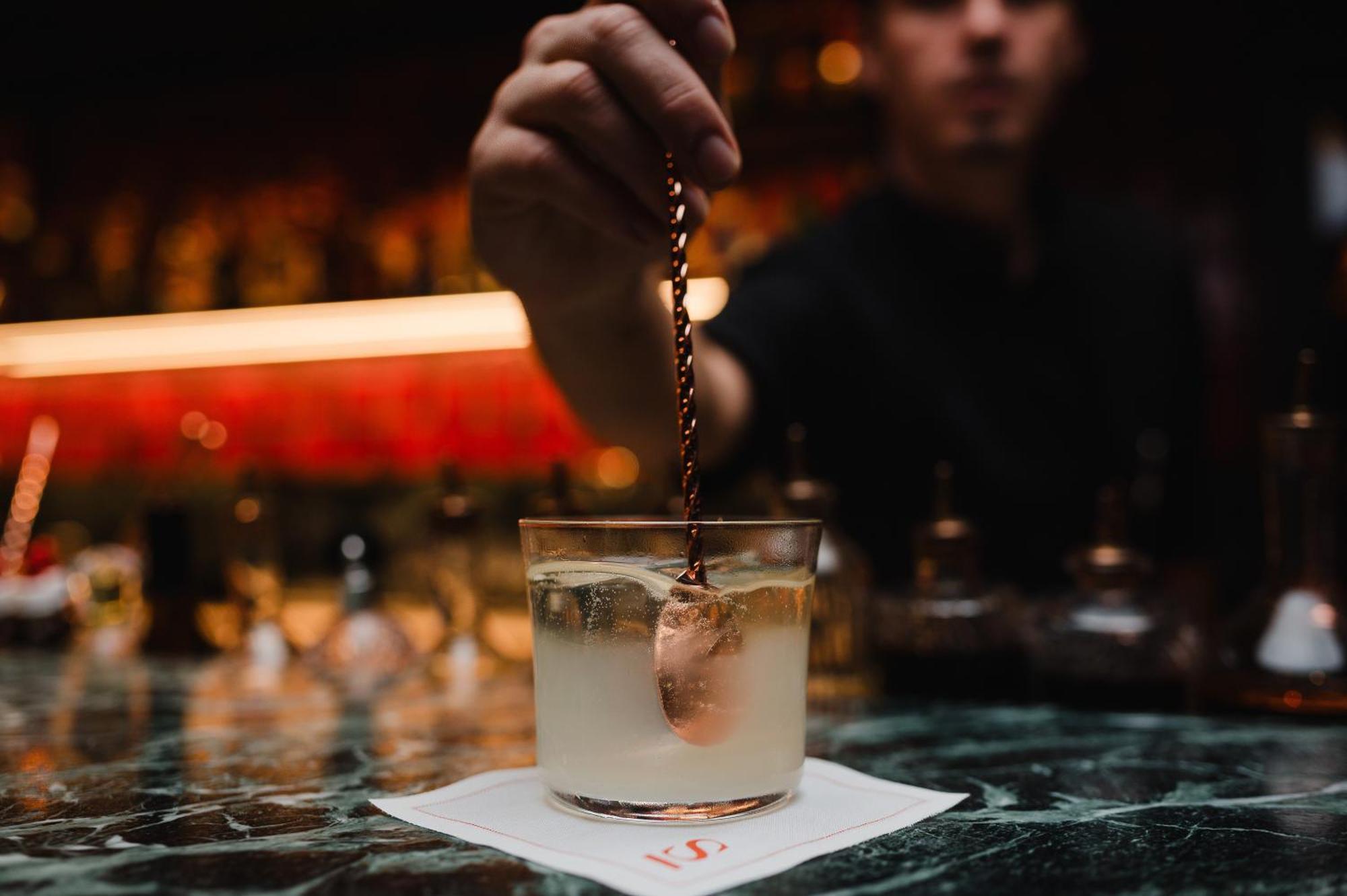 Sly Berlin Hotel Exterior photo A bartender adding a garnish to a cocktail